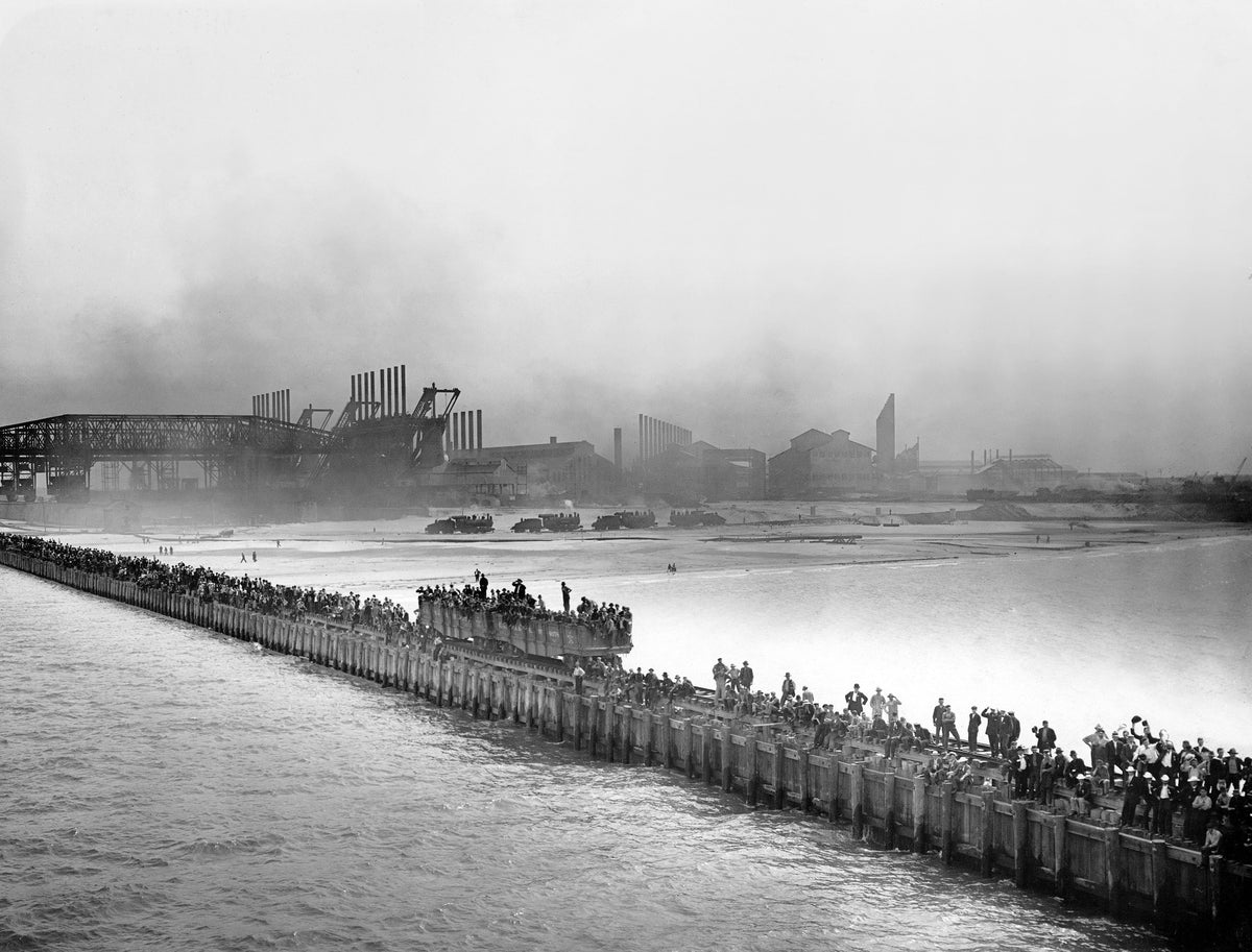 Gary steelworkers line the docks awaiting the first iron ore boat, the Elbert H. Gary, July 23, 1907. As U.S. Steel official Horace “Cap” Norton outlined at the time, “In the organization of a steel plant, there are three important events: the turning of the first spade full of earth; the arrival of the first cargo of iron ore; and the lighting of the first fire. In the construction of the plant at Gary, we have reached the second stage.” It was this momentous occasion that was celebrated by the Gary Commer