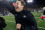 UGA coach Kirby Smart runs to celebrate with fans after winning a NCAA college football game between Georgia and Notre Dame at Notre Dame Stadium in South Bend, Indiana, Sept. 9, 2017. Joshua L. Jones, Athens Banner-Herald