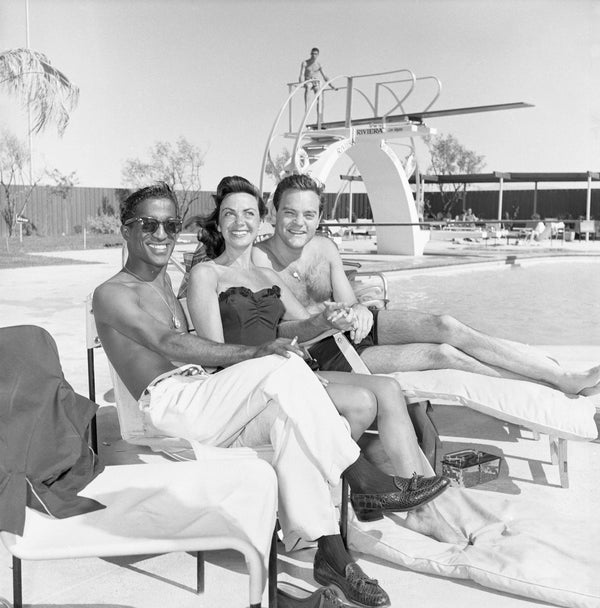 Entertainer Sammy Davis Jr. sits poolside at the Riviera with singer Helen Grayco and her bandleader husband, Spike Jones on July 2, 1955.Courtesy Nevada State Museum, Las Vegas, JAY FLORIAN MITCHELL COLLECTION