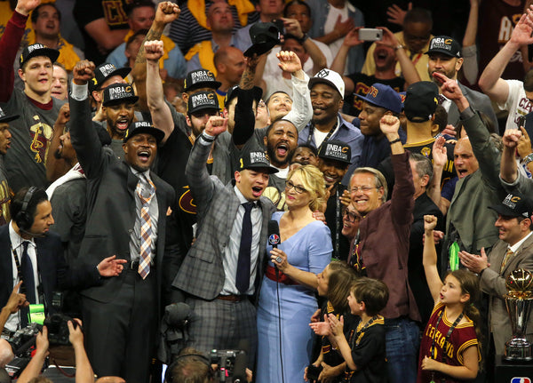 Cleveland Cavaliers head coach Tyronn Lue leads the cheers alongside team and owners in the NBA Finals Game 7 between the Cleveland Cavaliers and the Golden State Warriors played in Oakland on June 19, 2016. Thomas Ondrey / The Plain Dealer