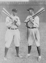 Ty Cobb of the Detroit Tigers (left) and Joe Jackson of the Cleveland Indians, standing alongside each other in 1913. Courtesy Library of Congress, Prints & Photographs Division / #LC-DIG-PPMSCA-31945