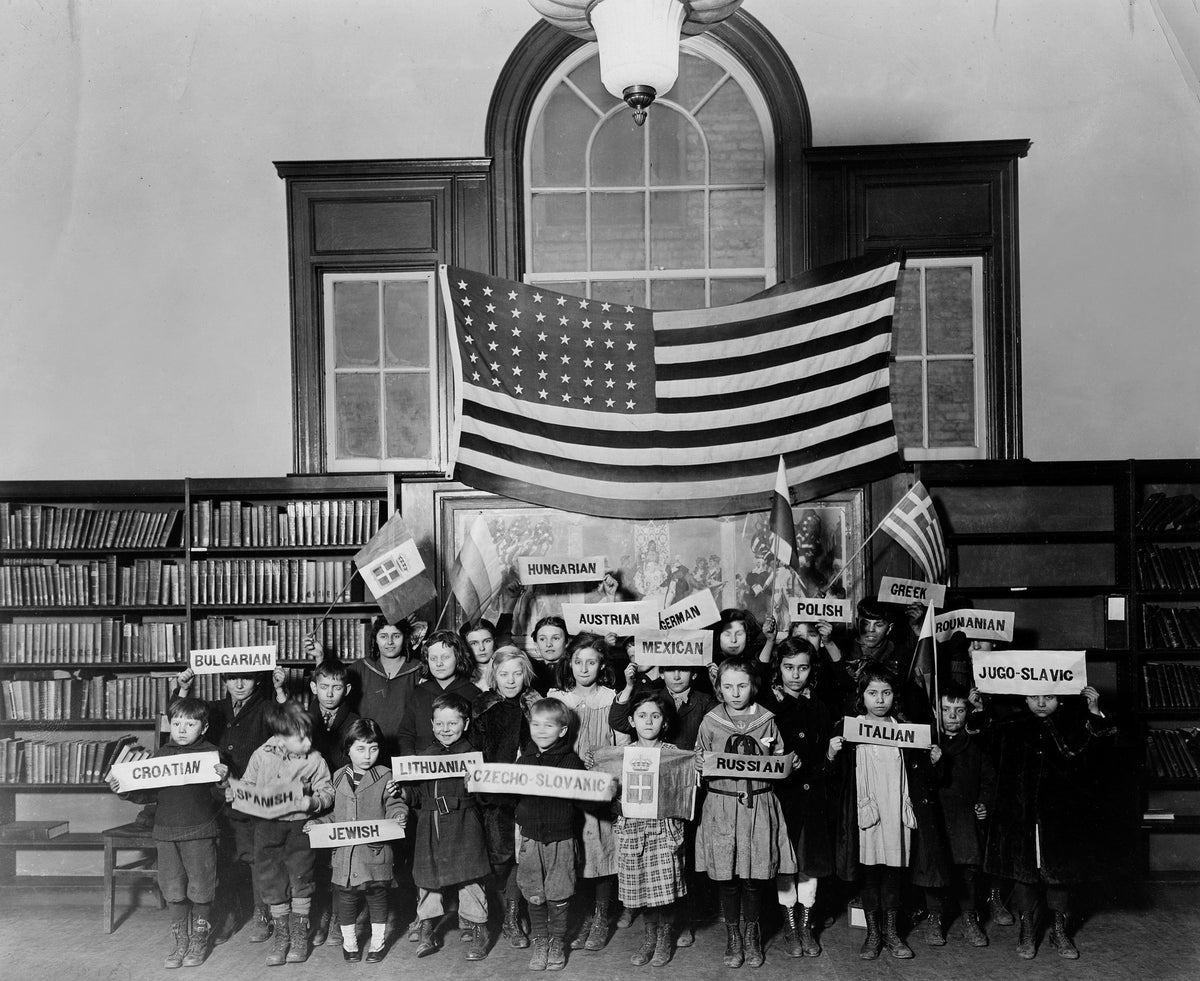 Ethnic children at Gary Public Library Bailly Branch, 1922. This south side branch housed the International Institute, a social agency to assist Gary’s 50 different nationalities. The Institute encouraged its clientele to celebrate its ethnic heritage, in this case by children holding up signs of their native land. Note the large American flag above the youngsters, sending the message that the newcomers could be both proud of their heritage and true Americans. Courtesy Calumet Regional Archives, Indiana Uni