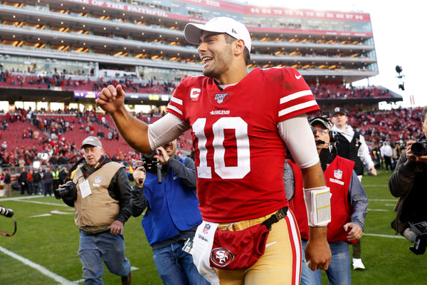 San Francisco 49ers' Jimmy Garoppolo runs off the field after Niners' 27-10 win over Minnesota Vikings in an NFC Divisional playoff game at Levi's Stadium in Santa Clara, Calif., on Jan. 11, 2020. Scott Strazzante/The Chronicle