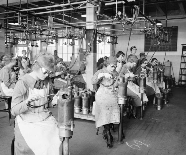 A room full of female workers weld machine parts at the Lincoln Motor Company during World War I. The automotive factories in Detroit supplied munitions, engines and vehicles for the war, and women were recruited to fill these jobs as men joined the armed services. Courtesy The Detroit News