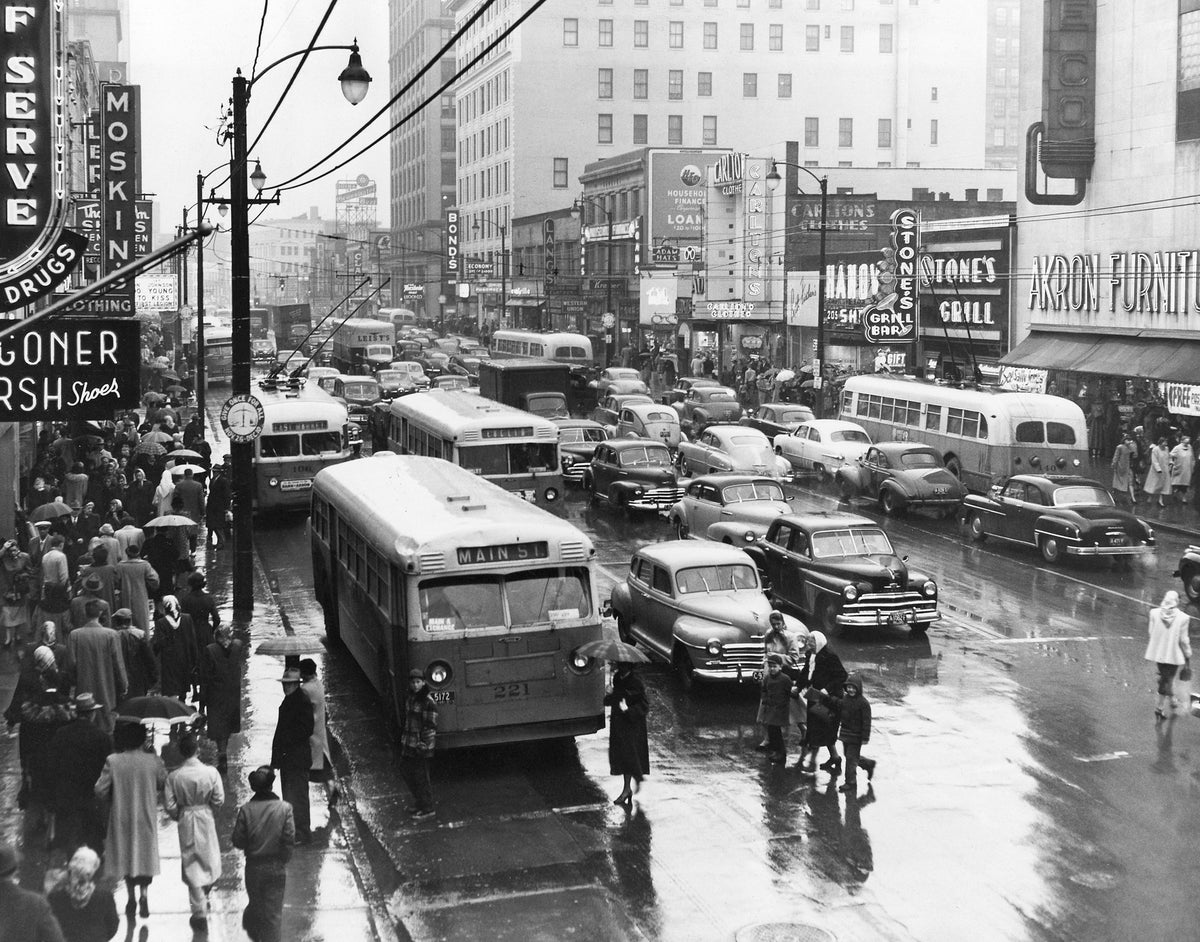 A cold drizzle doesn’t deter thousands of Akron residents from beginning their holiday shopping on South Main Street on the day after Thanksgiving, Akron, November 23, 1951. Courtesy Akron Beacon Journal