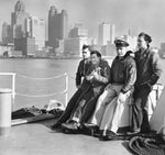 United States Coast Guard  crew members Fred French, Ted Knecht, Chief John Scott and Fireman Charles Way on a boat in the Detroit River, March 16, 1954. The Detroit News
