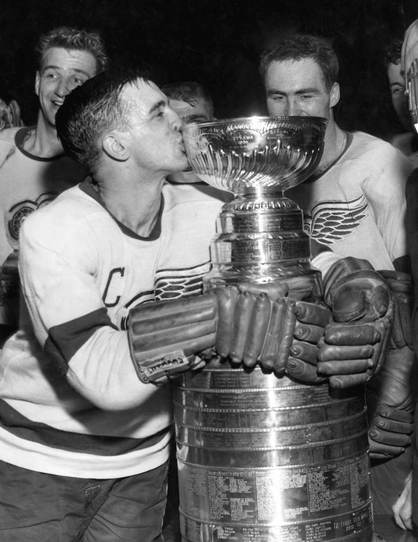 Detroit Red Wings captain Ted Lindsay kisses the Stanley Cup, after the Wings defeated the Montreal Canadiens 4-3 in 1955. The Detroit News