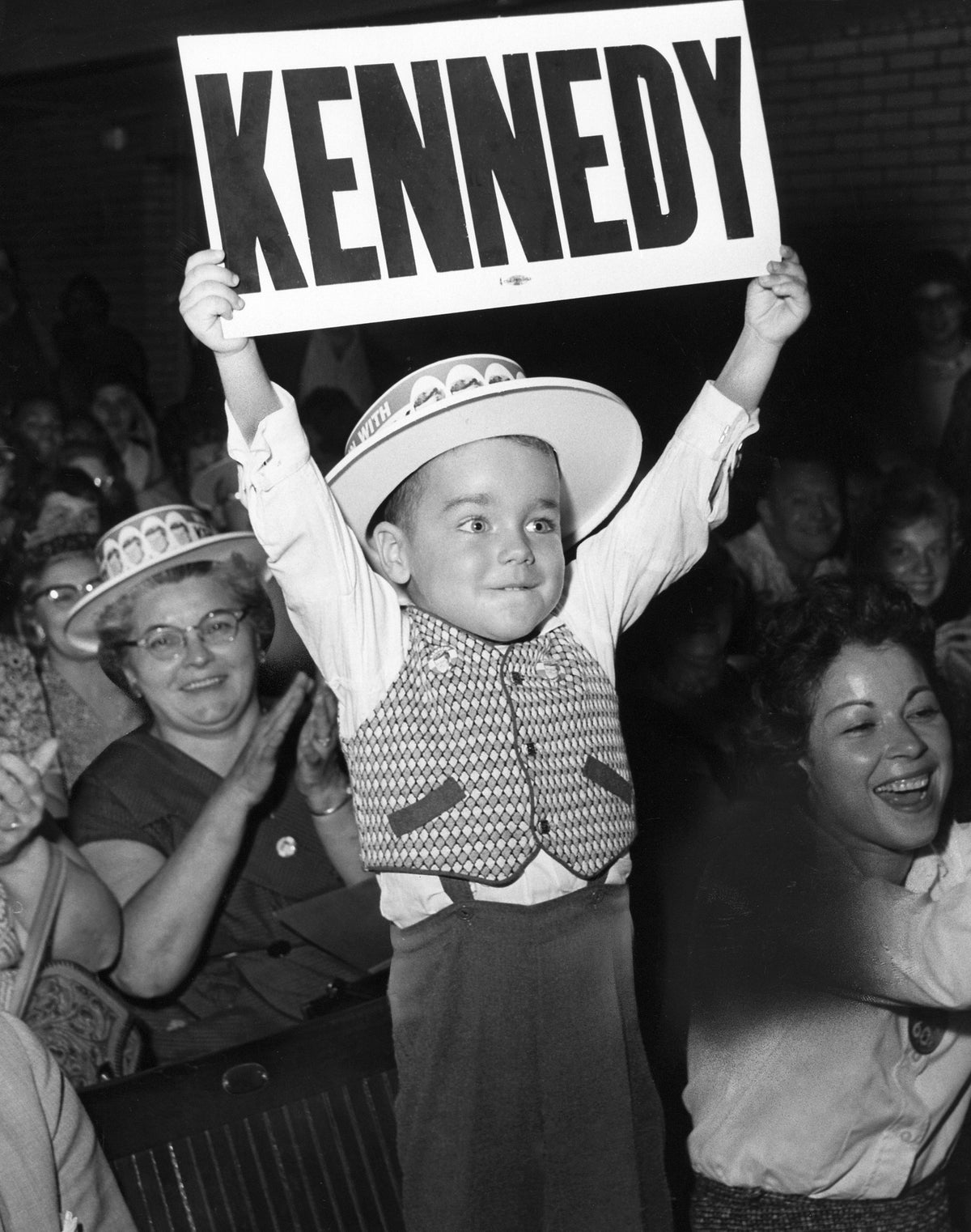 Coventry Township resident Michael Bline, age 3, shows his support for Senator John F. Kennedy during a rally for the presidential candidate at the Akron Armory, September 27, 1960. Courtesy Akron Beacon Journal
