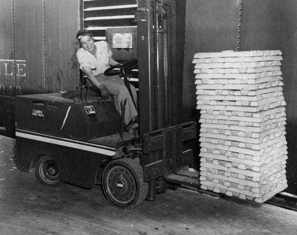Billie Oldham operates a forklift carrying magnesium ingots at Basic Magnesium Inc., 1943. The ingots were shipped out on the railcar located on the track behind Oldham. Courtesy Clark County Museum, BMI COLLECTION / #1974.104G.108