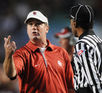 Oklahoma head coach Bob Stoops has a discussion with a game official Saturday, Nov. 6, 2010, during a Big 12 Conference game against Texas A&M in College Station. Transcript photo by Jerry Laizurre