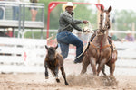 John Douch, of Huntsville, Texas, competes in tie-down roping. Michael Cummo / Wyoming Tribune Eagle