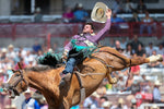 R.C. Landingham, of Hat Creek, Calif., competes in bareback bronc riding. Landingham received a score of 80 for the ride. Michael Cummo / Wyoming Tribune Eagle