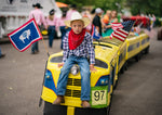 Miniature train rider Conner Olayeson, 6, waits for the Cheyenne Frontier Days parade to start, June 29, 2021. Michael Smith / For the Wyoming Tribune Eagle