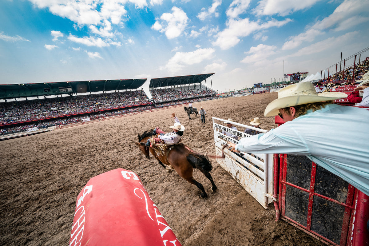 Bareback rider Tim O’Connell busts out of the chutes during the finals of the Cheyenne Frontier Days Rodeo. Michael Smith / For the Wyoming Tribune Eagle ^^ center light rgba(40,40,35,0.5)