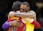 LeBron James greets former Cavaliers teammate Cedi Osman before tipoff of a Nov. 21, 2018, game between the Lakers and Cavs in Cleveland. John Kuntz / cleveland.com