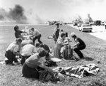 Rescue and emergency workers work at the scene of United Airline flight 232 crash site, Sioux Gateway Airport, Sioux City, July 19, 1989. The plane suffered catastrophic failure of its tail-mounted engine which led to the loss of all flight controls. Courtesy Sioux City Journal