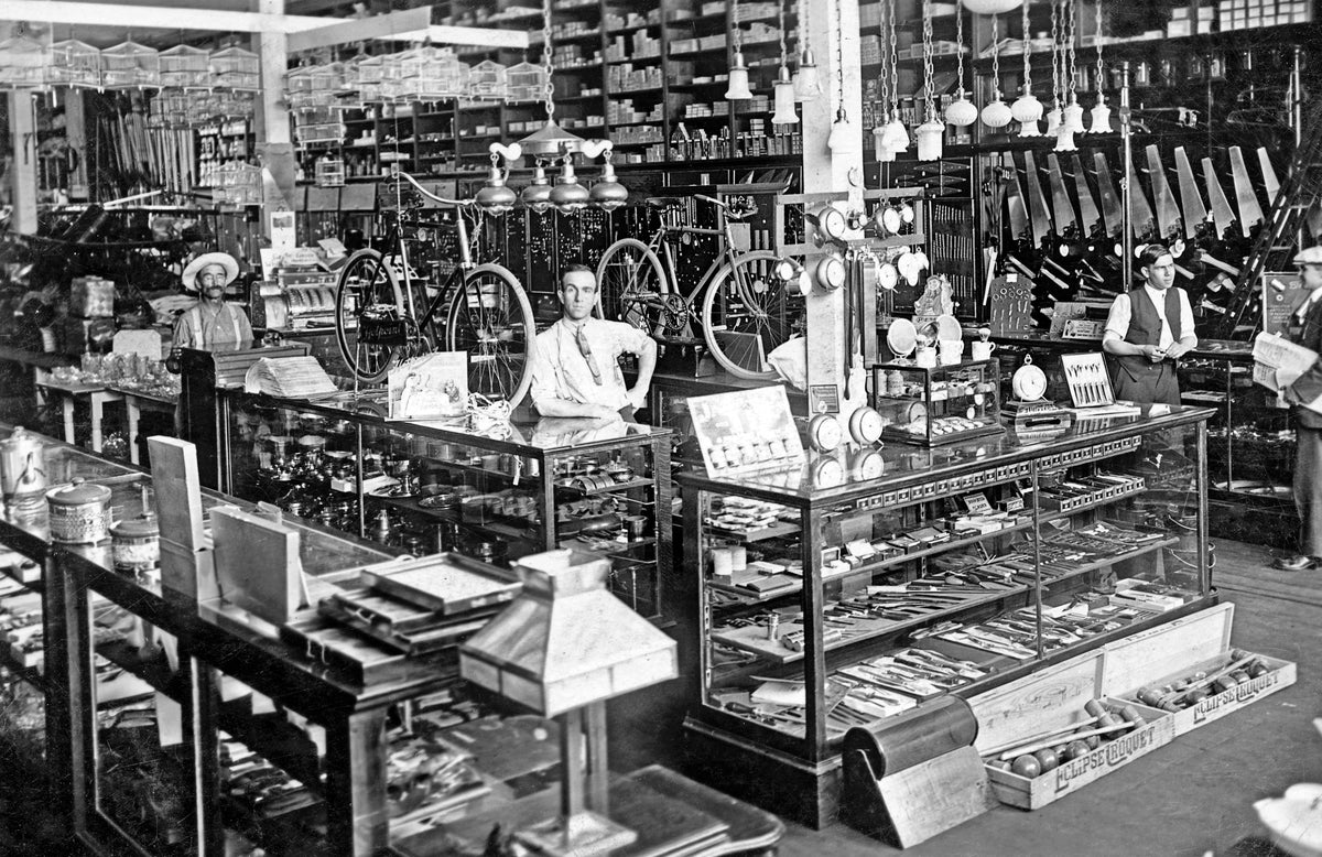 Lewiston Hardware Co., 1915. Pictured are Charles O. Gage, left, and Roy A. Gage, manager, center right. Courtesy HS 99-3-3