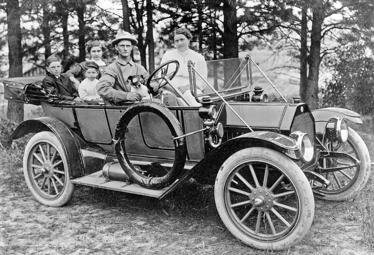 The Woods family in their car. John Woods is driving, with sons Earl J., left, and Leonard, middle, ride in back, circa 1910. Courtesy Tom Woods