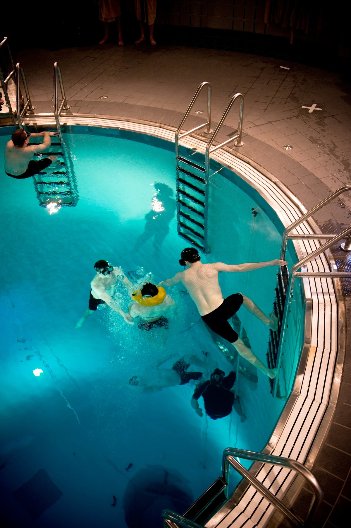 A student learns to properly ascend from 15 feet to the surface in a submarine escape trainer evolution at Momsem Hall, January 19, 2010. Courtesy U.S. Navy Photo
