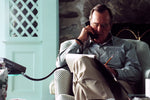 President Bush talks on the telephone to Turkish President Turgut Ozal during the National Security Briefing with Robert Gates and Andy Card in the living room of his home in Kennebunkport, Maine on August 16, 1990. Photo credit: George Bush Presidential Library