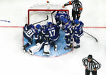 Tampa Bay Lightning goaltender Andrei Vasilevskiy (88) is blanketed by his team after he smothered the puck before it crossed the line in the final seconds of the third period as time expired and the Lightning avoided giving up a last-second goal to beat the Pittsburgh Penguins 3-2 on Oct. 23, 2019, in Tampa. The play was reviewed for several minutes and it was determined that the puck never crossed the goal line. Tampa Bay Times / Dirk Shadd
