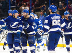 Yanni Gourde (37), left, laughs with fellow Tampa Bay Lightning center Cedric Paquette (13) as the Lightning celebrate their 4-0 shutout victory over the Montreal Canadiens on March 5, 2020, in Tampa. Tampa Bay Times / Dirk Shadd