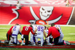 Bucs and Vikings players gather for prayer at the conclusion of the Dec. 13 game at Raymond James Stadium. TAMPA BAY TIMES / DOUGLAS R. CLIFFORD