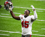 Defense plays a huge part in the Bucs’ postseason win at New Orleans, with Devin White notching a late interception to go with his earlier fumble recovery. TAMPA BAY TIMES / DIRK SHADD
