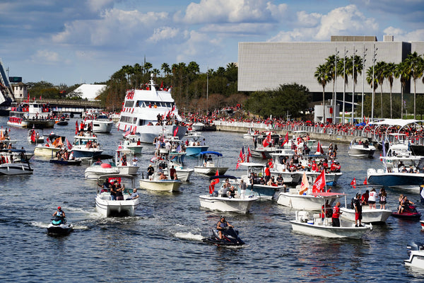 Just like fans turned out when the Lightning won the Stanley Cup months earlier, thousands of Bucs fans line the Riverwalk along the Hillsborough River to honor the home team. TAMPA BAY TIMES / LUIS SANTANA AND DIRK SHADD