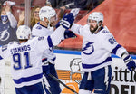 From left, Tampa Bay Lightning center Steven Stamkos (91), defenseman Victor Hedman (77) and right wing Nikita Kucherov (86) celebrate Kucherov’s goal as he scores a power play goal beating Florida Panthers goaltender Sergei Bobrovsky for his second goal of the game to take the lead 3-2 during second-period action in game one of the first round of the NHL Stanley Cup Playoffs at the BB&T Center on May 16, 2021, in Sunrise. Dirk Shadd / Tampa Bay Times