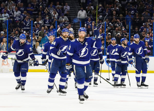 Tampa Bay Lightning captain Steven Stamkos (91) raises his stick along with his team at center ice after they defeat the Carolina Hurricanes 6-4 in game four of the second round of the NHL Stanley Cup Playoffs at Amalie Arena on June 5, 2021, in Tampa. Dirk Shadd / Tampa Bay Times