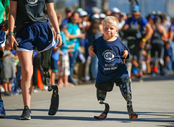 Zach Harrell of Clairemont runs in the Kid’s Run during the Challenged Athletes Foundation San Diego Triathlon Challenge in La Jolla on Oct. 20, 2019. K.C. Alfred / The San Diego Union-Tribune