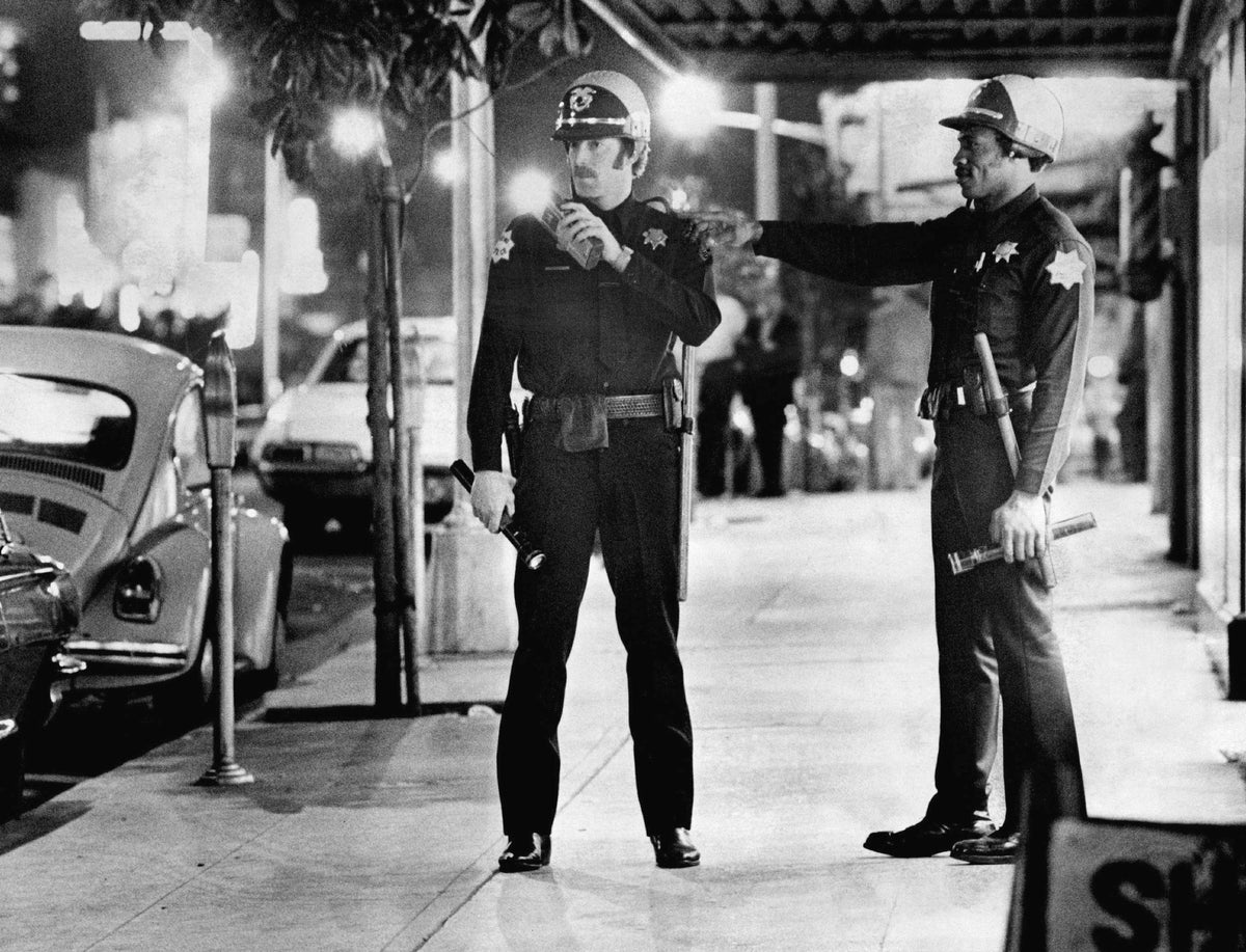 Officers Jim Conrad, left, and Kirkus Burks on patrol in Chinatown, 1976. Courtesy The Fresno Bee