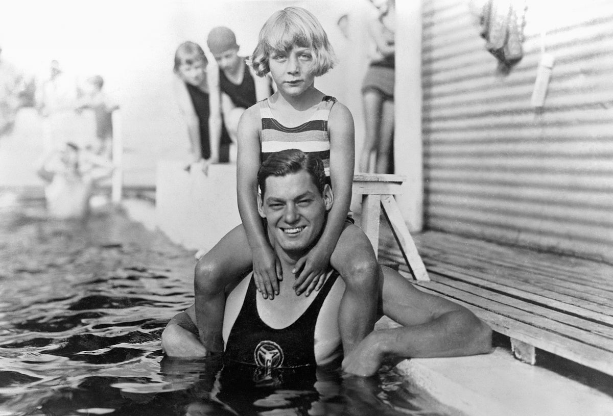 Johnny Weissmuller with Jackie Ott on his shoulder, 1920s. Weissmuller was best known for playing the role of Tarzan, and was also an excellent competitive swimmer. Courtesy Fort Lauderdale Historical Society
