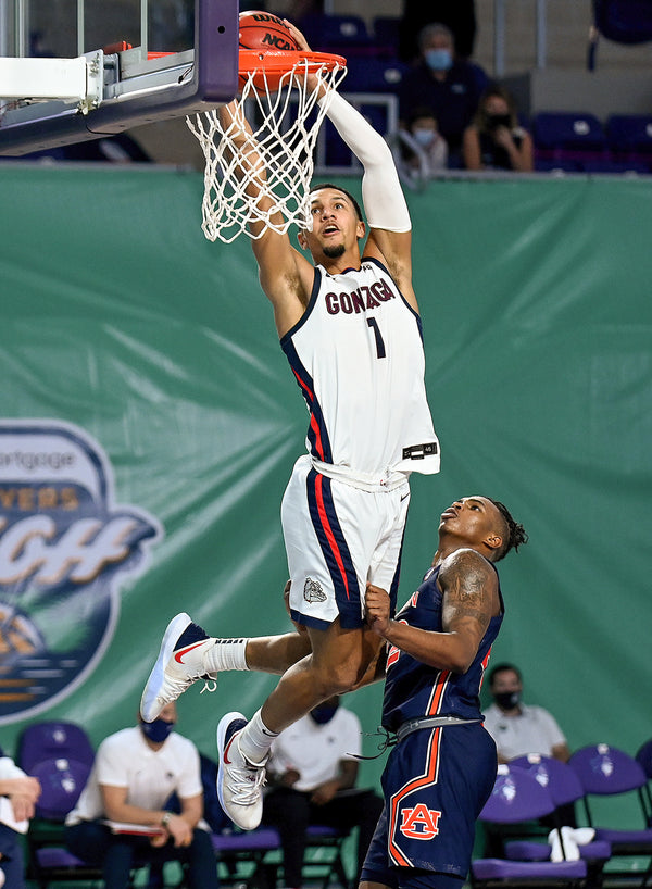 Gonzaga guard Jalen Suggs (1) rises above Auburn’s Allen Flanigan for a dunk on Nov. 27, 2020, at the Fort Myers Tip-Off in Fort Myers, Fla. Chris Tilley / Fort Myers Tip-Off