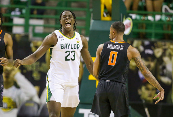 Baylor forward Jonathan Tchamwa Tchatchoua reacts to a turnover while Oklahoma State guard Avery Anderson III (right) looks on in the first half. Courtesy Rod Aydelotte / Waco Tribune-Herald