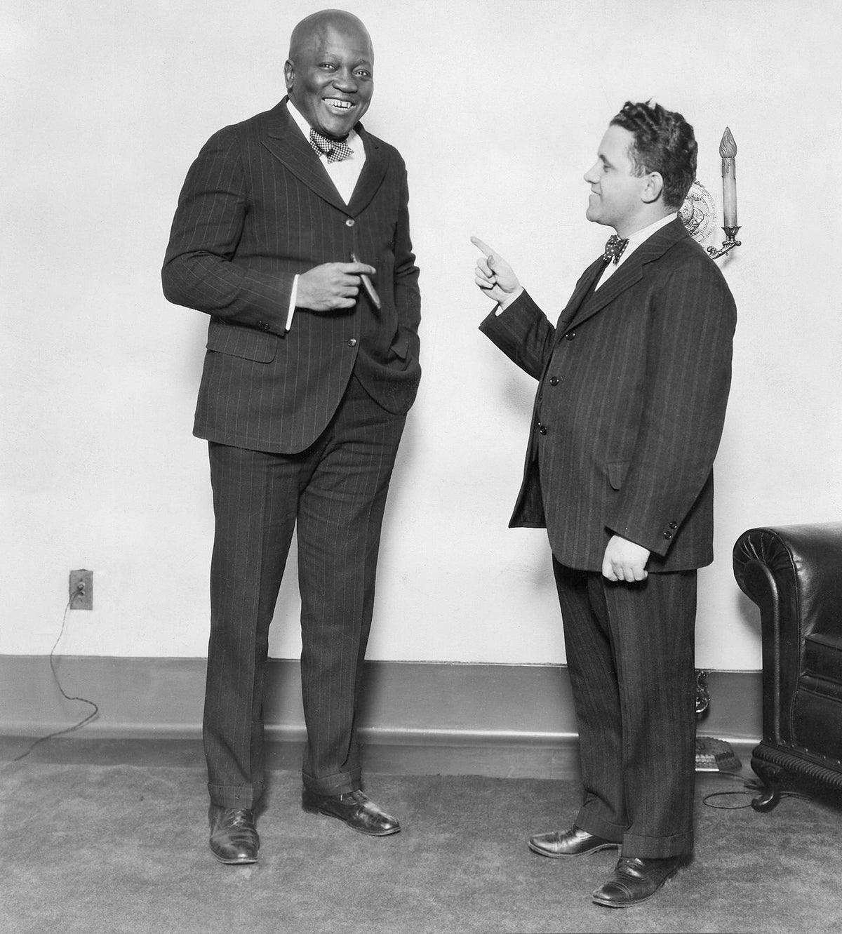 Champion heavyweight boxer Jack Johnson being interviewed by The Scranton Times writer Joe M. Butler in The Scranton Times radio reception room, Nov. 30, 1929. Courtesy Scranton Times-Tribune