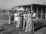 A group of women who called themselves the Arizona Panhandlers stand outside a BMI townsite home, 1943. They all lived on Arizona Way at the townsite. From left, Bea Kruger, Sonia Dewart, Bertha Hansen, Ruby Kneip, Laura Bradley, Mary Canup, Corinne Ellsworth and Alice Jane Fitchett. Courtesy HENDERSON LIBRARIES DIGITAL ARCHIVES