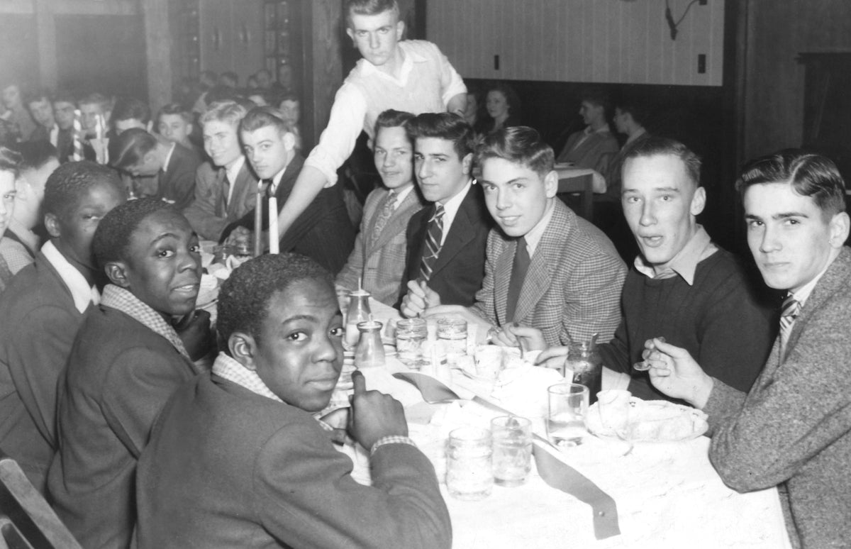 Orrville High School football banquet, 1940s. Those identified on the left side of the table: Bill Settles and twins David and Donald Hudson. Right side of the table: unidentified, William Wilford, unidentified, Joe Codiano, Kenny Fordenwalt, Don Steele. Courtesy Orrville Historical Society