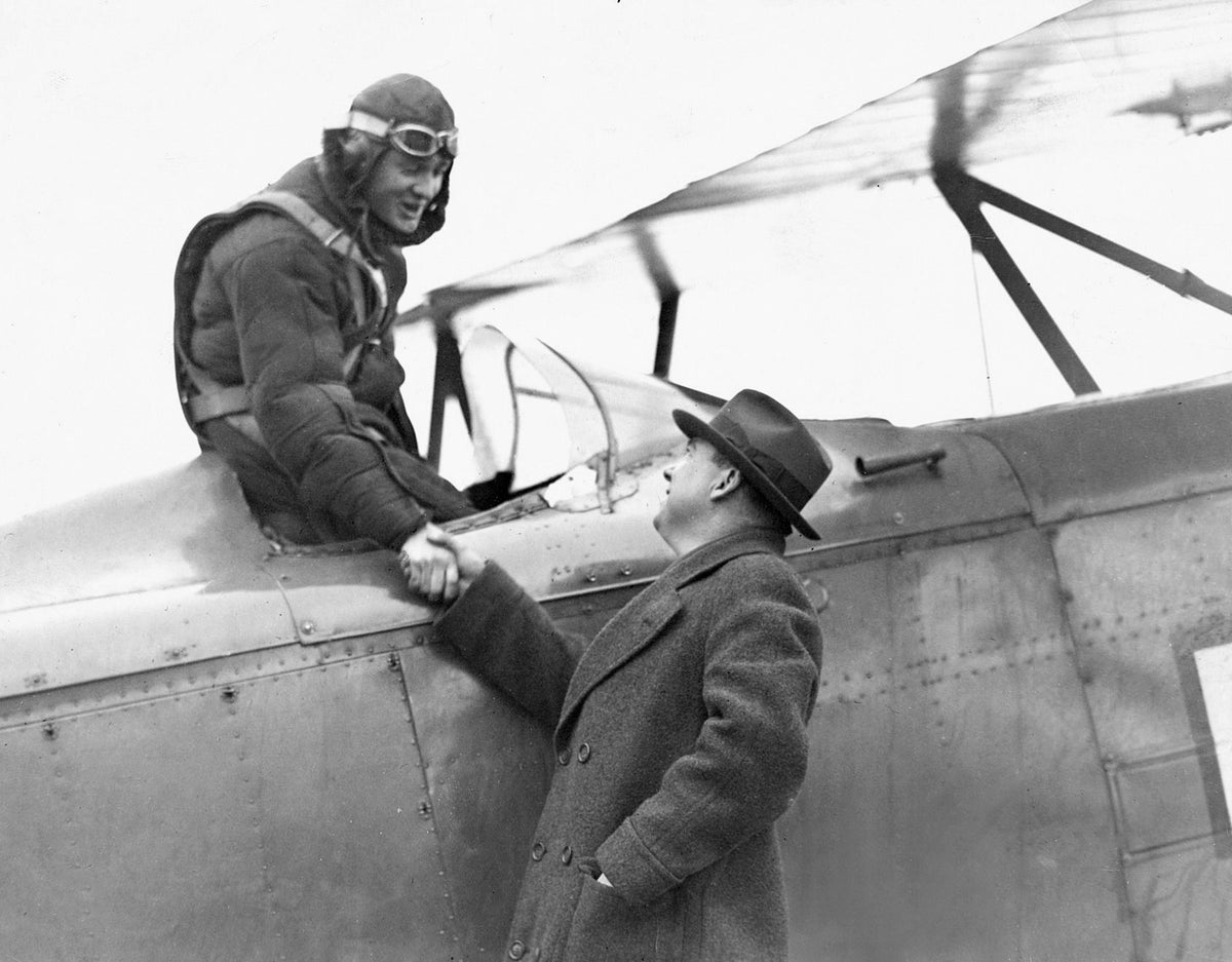 U.S. Mail pilot Robert Hopkins shaking hands with Scranton Times staff representative E.J. Gerrity before leaving for Newark, N.J. on Jan. 10, 1931. Hopkins was forced down in Cathedral Cemetery the previous day and told Gerrity to “tell the Scranton folks I am thankful for their fine treatment of me and I’ll drop in again sometime when I can stay longer.” In April 1931, Hopkins died from injuries in an automobile crash. Courtesy Scranton Times-Tribune