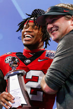 Georgia coach Kirby Smart celebrates with defensive MVP Georgia defensive back Javon Bullard (22) after the game. Joshua L. Jones / Athens Banner-Herald