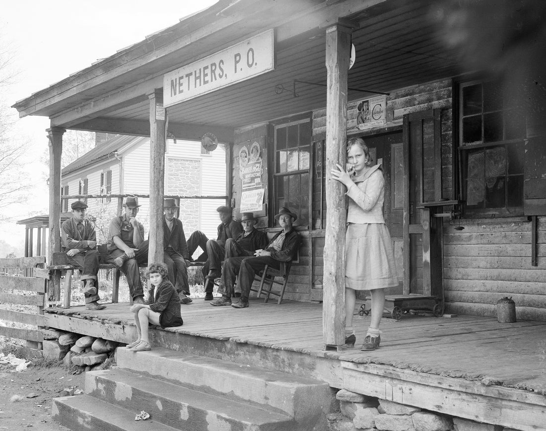Nethers Post Office near Shenandoah National Park, Madison County, October 1935. From left: Wm. Grover Jenkins, Jesse Jenkins, John Sisk, Millard Dodson, John Henry Lillard and Ernest Dodson, Ruth Hudson (sitting) and Dorothy Nicholson Jenkins (standing). Courtesy Library of Congress / #LC-DIG-fsa-8b26683