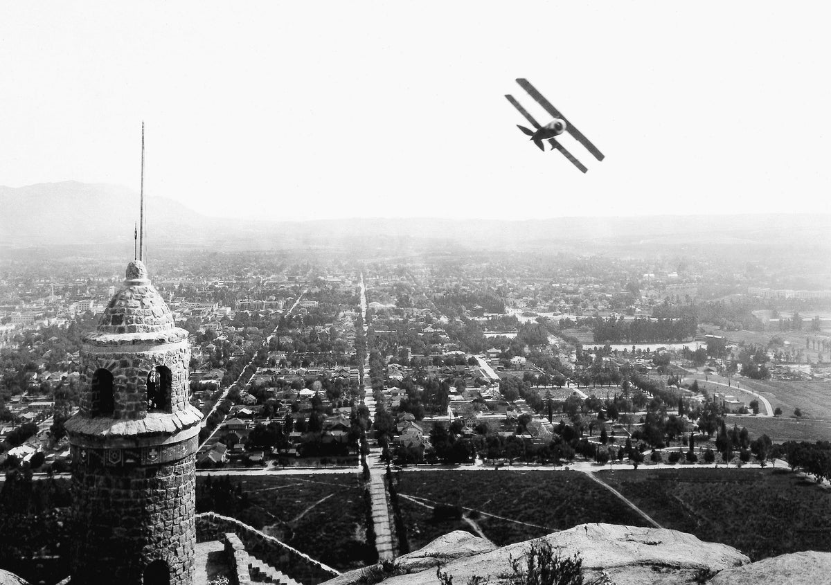 Roman Warren, the “Cowboy Aviator,” flying his biplane by the Mount Rubidoux Peace Tower, June 13, 1926. Courtesy Museum of Riverside, E. N. Fairchild Photograph Collection