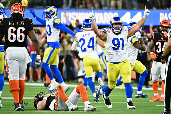 Los Angeles Rams nose tackle Greg Gaines (91) celebrates after defensive end Aaron Donald (99) forced Cincinnati Bengals quarterback Joe Burrow (9) into an incomplete pass during the second half in Super Bowl LVI at SoFi Stadium on Sunday, Feb. 13, 2022 in Inglewood, CA. Wally Skalij / Los Angeles Times