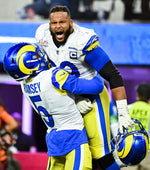 Los Angeles Rams defensive end Aaron Donald (99) celebrates with cornerback Jalen Ramsey (5) after pressuring Cincinnati Bengals quarterback Joe Burrow (9) into an incomplete pass on fourth down during the second half in Super Bowl LVI at SoFi Stadium on Sunday, Feb. 13, 2022 in Inglewood, CA. Wally Skalij / Los Angeles Times