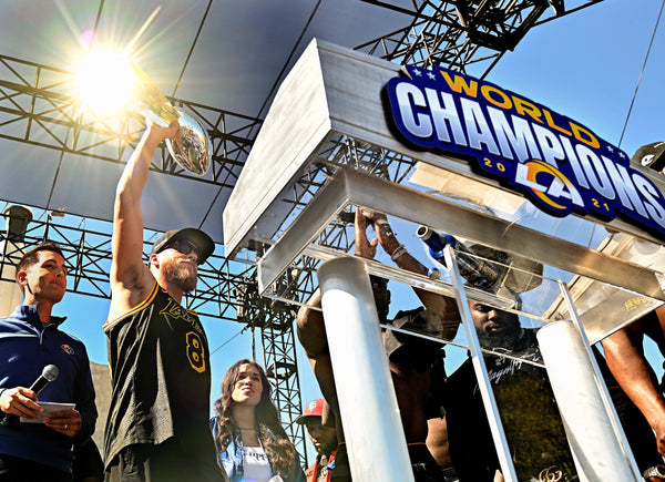 Rams receivers Cooper Kupp holds the Super Bowl Championship trophy during a celebration in front of the Coliseum Wednesday. Wally Skalij/Los Angeles Times