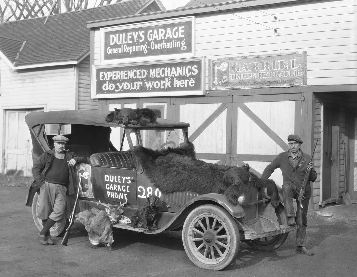 Hunters at Duley's Garage, circa 1920. Courtesy Clinton County Historical Museum