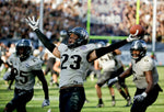 UCF’s Tre Neal celebrates after intercepting a Memphis pass in the second overtime to end the game and give UCF the American Athletic Conference championship. AP Photo / John Raoux