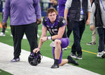 TCU quarterback Max Duggan takes a knee on the sideline after being defeated in overtime by Kansas State in the 2022 Dr. Pepper Big 12 Championship on Dec. 3, 2022. (Amanda McCoy / Fort Worth Star-Telegram)