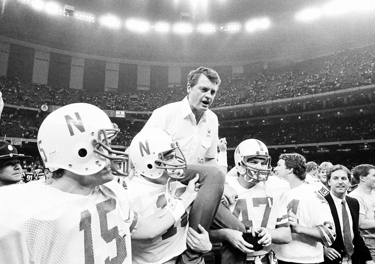 Tom Osborne is carried off the field by team members after the Huskers won the Sugar Bowl on Jan. 1, 1985, in New Orleans. Nebraska defeated LSU 28-10. From left are quarterback Craig Sundberg, Bret Clark, Osborne and Dan Wingard. Sundberg was named MVP of the game. Courtesy AP